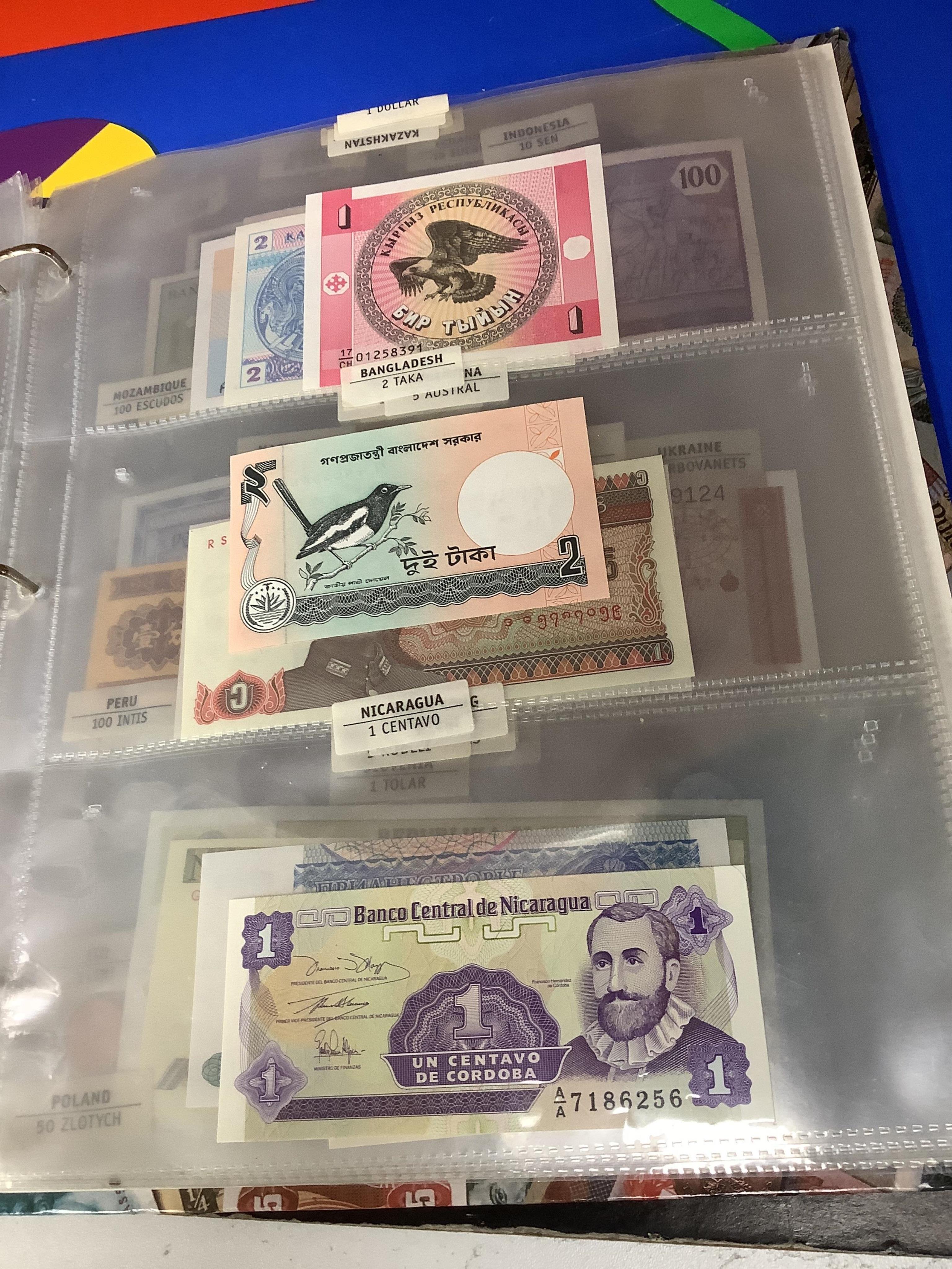 World coins and banknotes, including ‘crowns of the world’ Bermuda, Canada South Africa etc some may be replicas, in three albums, together with examples in clear plastic wallets the majority 1950 or later